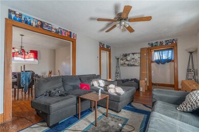 Living room opens to the dining room. Wood trim throughout.