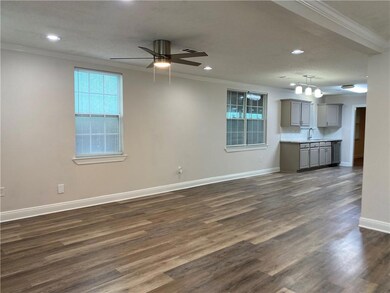 Living Rm flows into Breakfast Rm and Kitchen