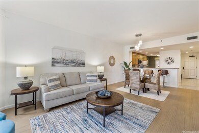 The living room and dining room with the kitchen j
