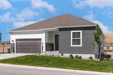 View of front of house featuring concrete driveway, a garage, board and batten siding, a front lawn, and a shingled roof