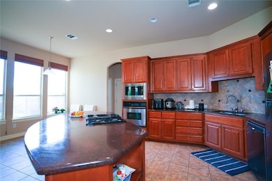 Kitchen with stainless steel appliances, arched w