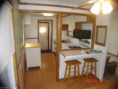 Opposite view of kitchen.  Note breakfast bar.