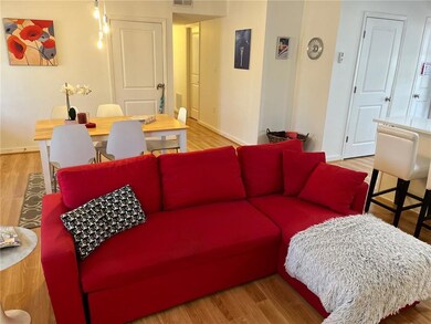 Living room featuring wood style floors, and visible vents