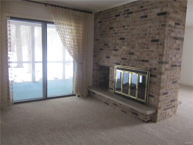 DEN WITH 2 SIDED GAS FIREPLACE AND SLIDER TO SCREE