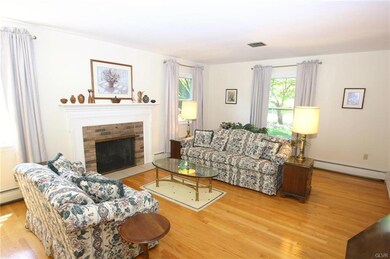 Living room with brick fireplace
