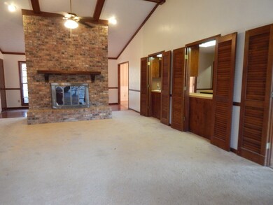 Great Room with Vaulted Ceiling and Exposed Beams