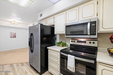 Kitchen with new stove and microwave