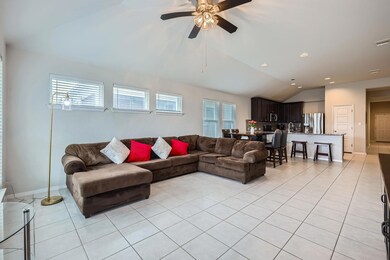 Living area featuring light tile patterned floors