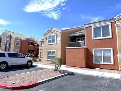 View of property with uncovered parking