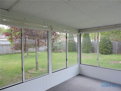 3-season porch off kitchen dining area overlooking