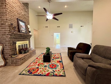 Exposed Brick Fireplace and Ceiling Fan