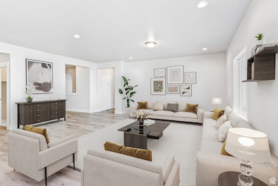 Living room featuring wood finished floors and recessed lighting