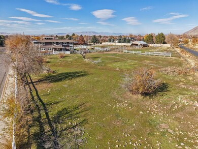 View of property location with a mountain backdrop and rural landscape