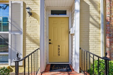 View of exterior entry with brick siding