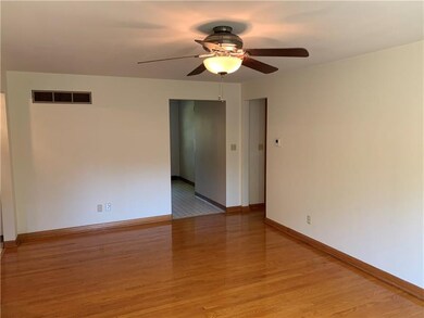 LIVING ROOM TO KITCHEN AND HALLWAY TO BEDROOMS AND