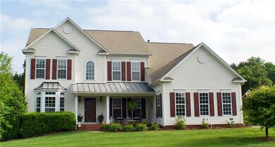 Great curb appeal, lush landscaping, covered front