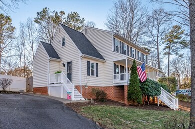 View of front of property with fence, stairway, a