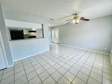 Unfurnished living room with ceiling fan, a textu