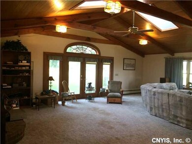 Family Room Beautiful windows and doors overlook a