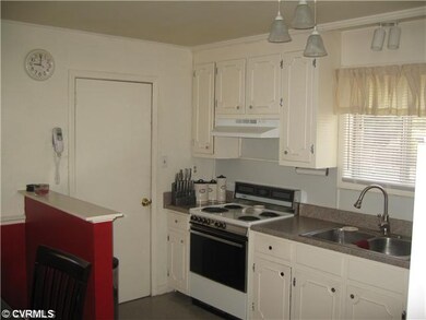 Kitchen - Nice natural light, door to utility room