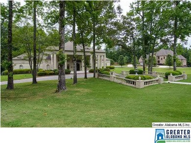 Shady patio area with fountain at front of home.