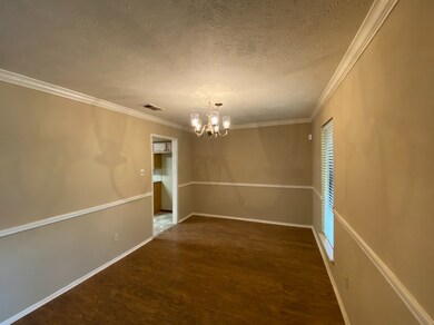 Formal dining room with direct access to kitchen.