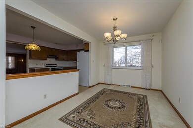 Dining room with hardwood floors under carpet