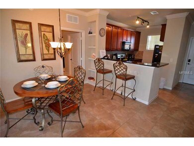 Dining Room - Dining Room, Breakfast Bar, and Kitchen.  Front door and Foyer beyond on right and Master Bedroom entry on left.