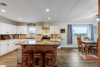 Kitchen featuring stainless steel electric range 