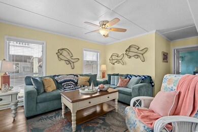 Living room with wood finished floors, ornamental 