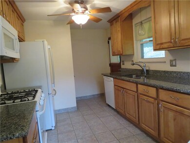 Updated Maple cabinets, stone counters, ceramic ti