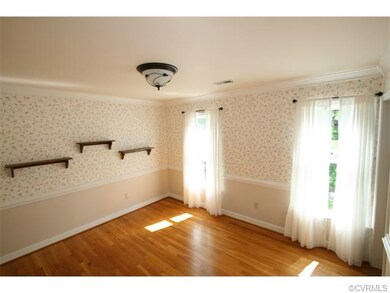 dining Room with moldings and crown railing