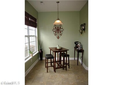 Breakfast. The cozy breakfast area overlooks the deck and wooded space.  This is the perfect room to enjoy quick meals!