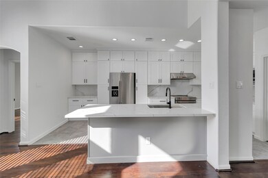 This kitchen is by far any chef’s dream! This spacious kitchen features high ceilings, white stained wood cabinets, quartz countertops, SS appliances, recessed lighting, extended counter space, large island with space for breakfast bar, and a walk-in pantry all overlooking your huge family room.
