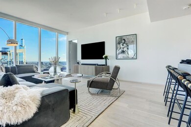 Living area featuring a wall of windows and wood 