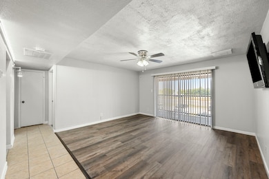 Light and bright open living area with LVT flooring. Recent interior paint.