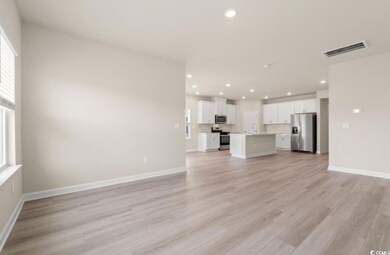 Unfurnished living room with plenty of natural lig