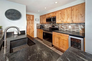 Kitchen featuring stainless steel appliances, beve