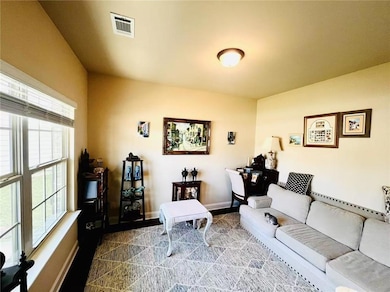 Living area featuring baseboards