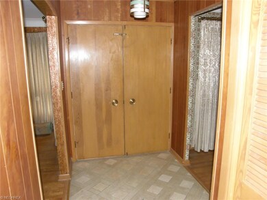 Entry foyer. Living room to the left with dining room on the right.