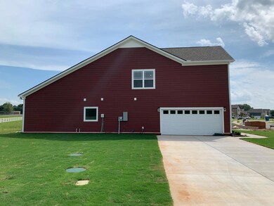 this house is located on a corner lot with a side entry garage