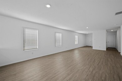 Unfurnished living room featuring light wood-type 
