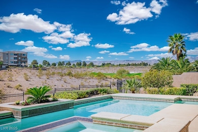 View of pool featuring an in-ground hot tub, a mou