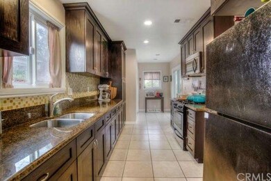 large galley style kitchen with ganite counters an