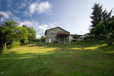 view of extra lot and home