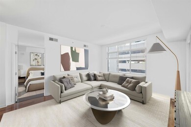 Living area featuring visible vents and wood fini