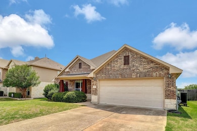 View of front of home with stone siding, concrete