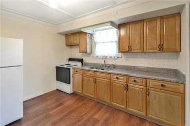 Another view of the kitchen. Electric stove and re