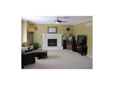 Sunlit Family Room With Crown Molding