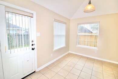 Cozy breakfast area leads the backyard!